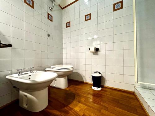 a bathroom with a toilet and a sink at Vintage Flat, Centro storico, Cagliari in Cagliari