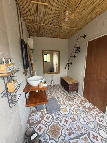 a bathroom with a sink and a mirror in a room at Glorious Stay in Porterville