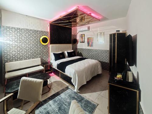 a bedroom with a bed and a tv in it at İstanbul Royal Hotel Kumkapı in Istanbul