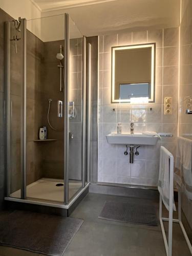 a bathroom with a shower and a sink at apartment37 in Detmold