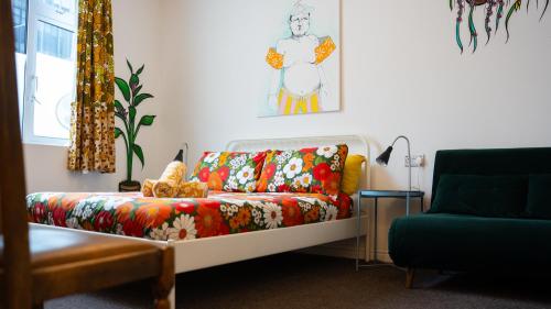 a living room with a couch and a chair at Igloo Hybrid in Nottingham