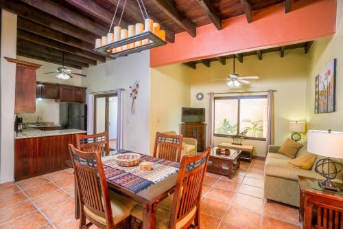 a dining room and living room with a table and chairs at Bananarama Dive & Beach Resort in West Bay