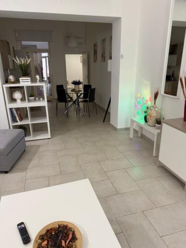 a living room with a couch and a table at Apulian Dreams in Brindisi
