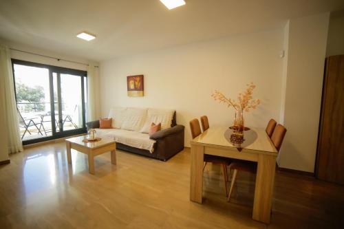 a living room with a couch and a table at Moraira Calamora in Moraira