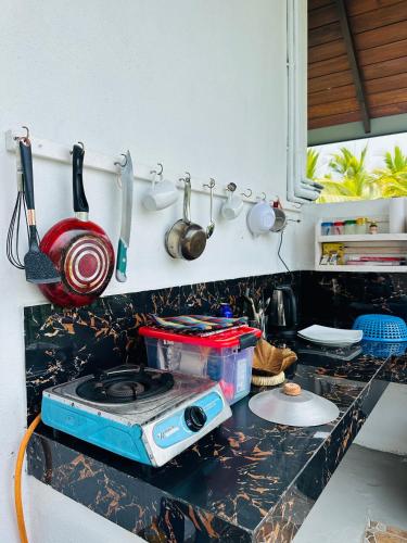 a kitchen counter with a toaster on a counter top at Dacha Retreat in Midigama East