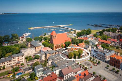 an aerial view of a city with a harbor at Kamienica Pod Neptunem - Rynek Puck - Śniadanie w cenie - 200m do Molo in Puck