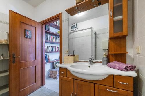 a bathroom with a sink and a mirror at Ca du Aldo - La Crema in Finale Ligure