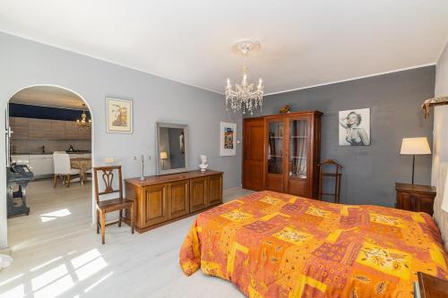 a bedroom with a bed and a desk and a chair at Ca du Aldo - La Crema in Finale Ligure