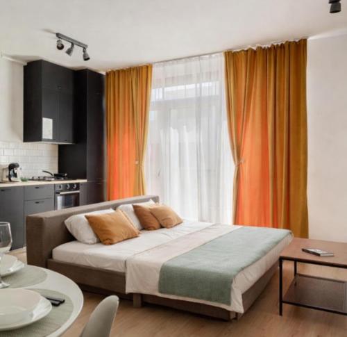 a bedroom with a large bed in front of a window at Sika Nobless Apartment - cazare premium Arad - self check-in in Arad