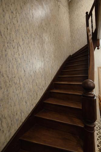 a staircase in a building with wooden steps at Creil Sud, près de l'Oise in Creil