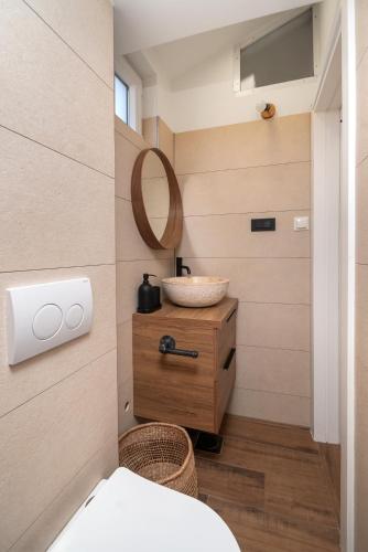 a bathroom with a toilet and a sink at Adria in Vodice