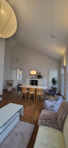 a living room with a couch and a table at Ferienhaus an der Allee in Kalkar