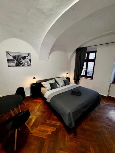 a bedroom with a large bed in a room at Lacná izba v centre in Banská Bystrica