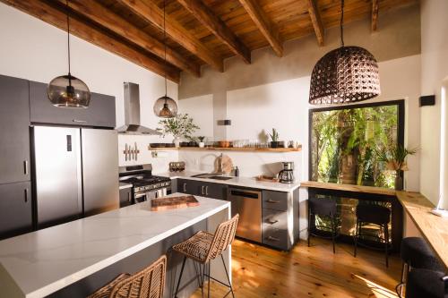 a kitchen with a large island in a room at Villa Sea Breeze in West End