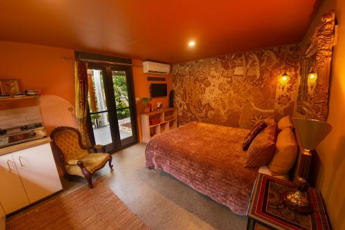 Lova arba lovos apgyvendinimo įstaigoje Tranquil Rainforest Studio Kuranda