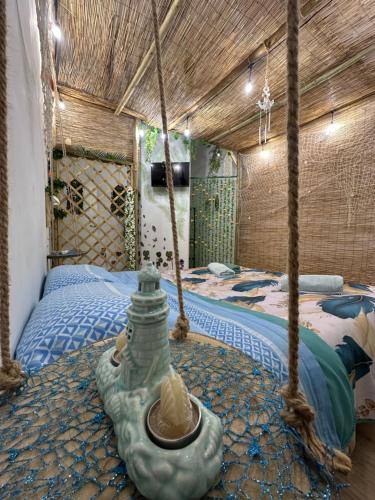 a bedroom with a bed with two ropes at La Casa Delle Conchiglie in Catania