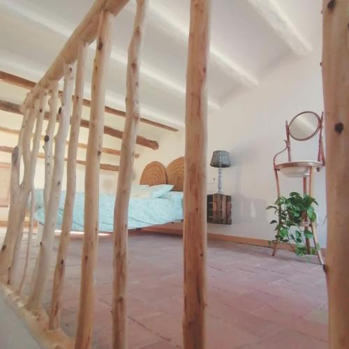 a bedroom with a bed in a room at Escapada rural en Nulles, cerca de Tarragona in Nulles
