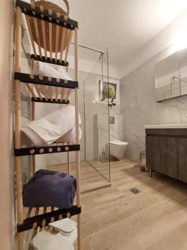 a bathroom with a bunk bed and a shower at Pine Lodge in Kavála