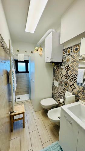 a bathroom with a toilet and a sink at Casa tua a Pergusa in Pergusa