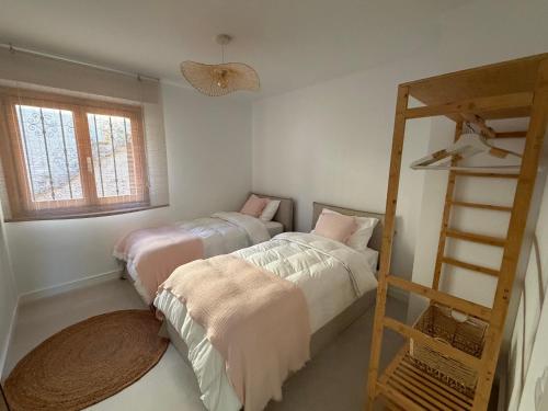 a bedroom with two beds and a ladder at ALTEA LUXURY - Blue Pearl in Altea la Vieja
