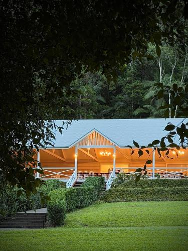 a large building with lights on the side of it at Nightcap Ridge - Byron Bay Hinterland in Dorroughby