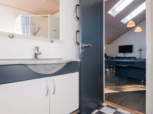a bathroom with a sink and a mirror at 14 person holiday home in Blåvand in Blåvand