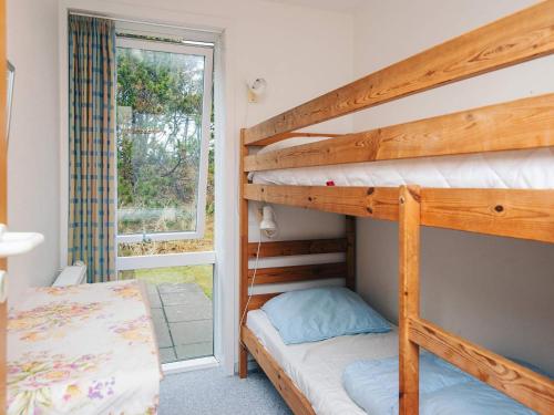 a bunk bed in a room with a bunk beduteneway at 6 person holiday home in Rømø-By Traum in Sønderby