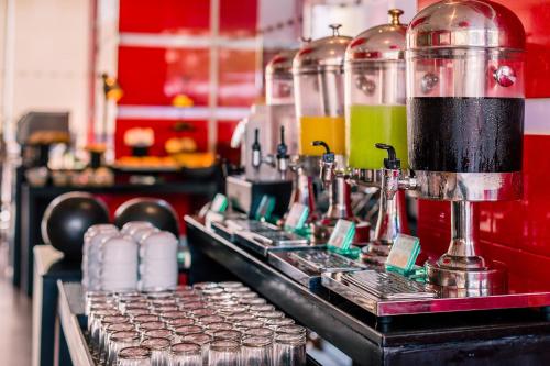 a kitchen with a counter with a coffee machine at Nova Platinum Hotel in Pattaya South