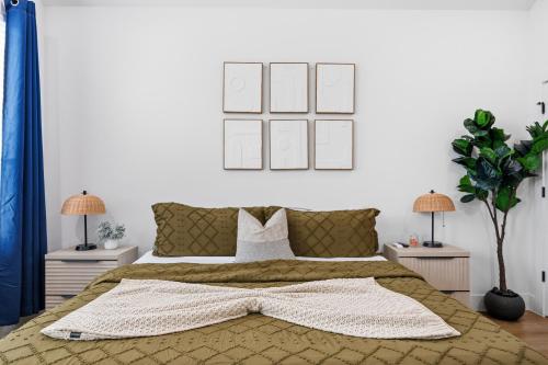 a bedroom with a large bed with a blanket at The Right House @ East Downtown in Houston
