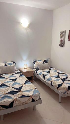 Casa Oceano tesisinde bir odada yatak veya yataklar