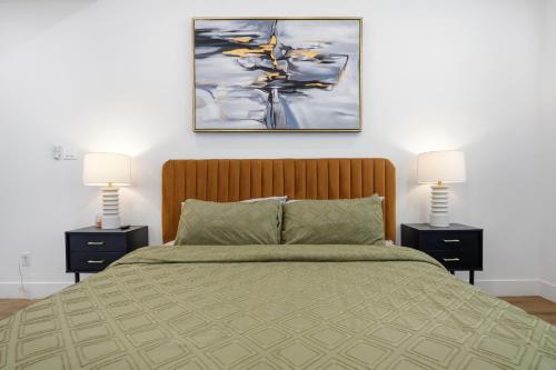 a bedroom with a large bed with two night stands at The Right Studio @ East Downtown in Houston