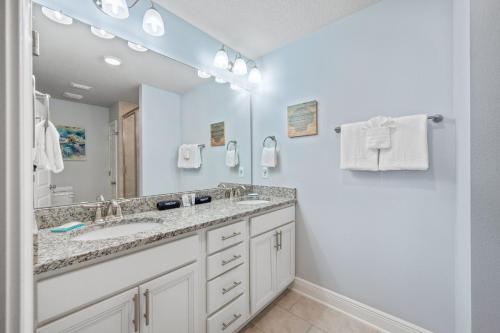 a bathroom with a sink and a mirror at SEA-Bound STR in Pensacola