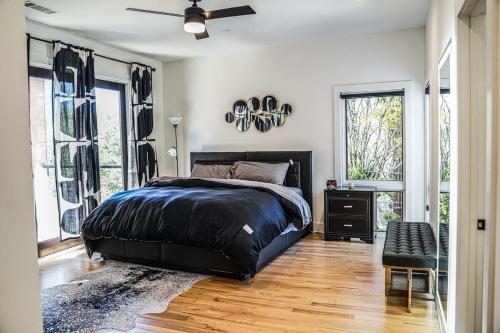 a bedroom with a bed and a ceiling fan at Stairway To Heaven in Atlanta