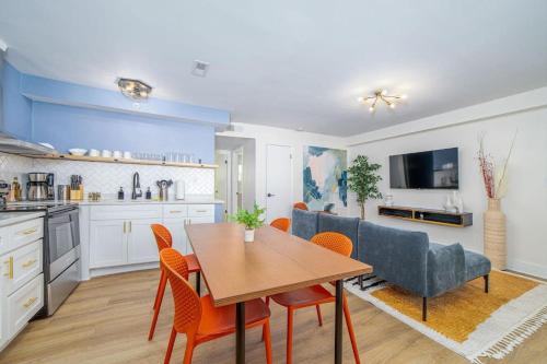 a kitchen and dining room with a table and chairs at Sojourn's Harborage 2 BR 1 BA in Norfolk