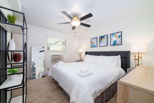 a bedroom with a bed and a ceiling fan at Sojourn's Harborage Pet-Friendly # 3 in Norfolk