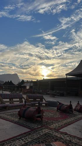 a group of chairs sitting on a rug in a courtyard at Sunset mountain in Disah