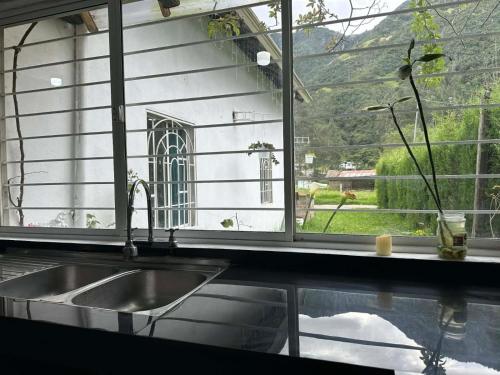 a kitchen sink in front of a window at Villablanca in Cuenca