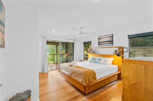 a bedroom with a bed and a tub in it at Surf Gums, Sleeps 9, Pet Friendly, Fully Renovated in Point Lookout