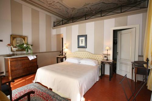Postel nebo postele na pokoji v ubytování Hotel Villa Beccaris