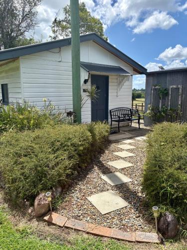 a building with a bench in front of it at Edington on Mary - The Dairy in Gympie