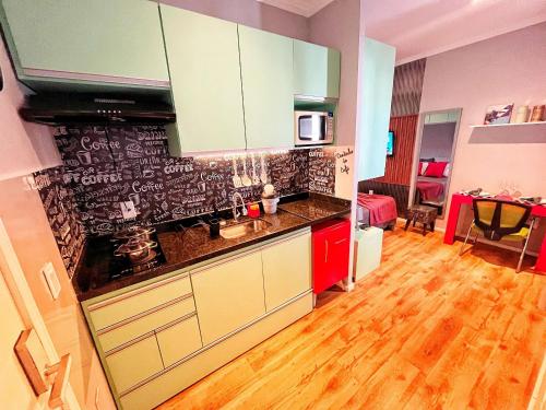 a kitchen with a sink and a counter top at The Birthplace of Samba Carioca in Rio de Janeiro