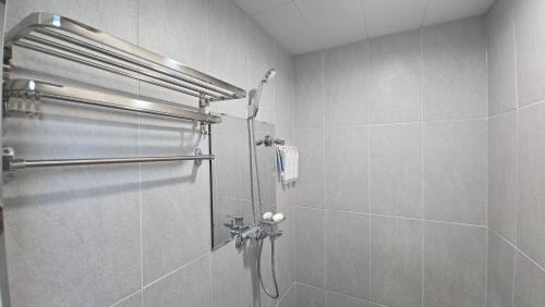 a bathroom with a shower with a glass door at 여주여행자센터 호스텔 in Yeoju