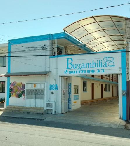 a blue and white building with a sign on it at Bugambilia Campeche in Campeche