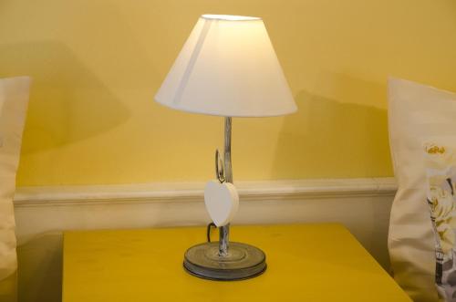 a lamp sitting on top of a table at Albergo al Sole in Val di Zoldo