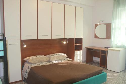 מיטה או מיטות בחדר ב-I due Baroni - fronte Campus