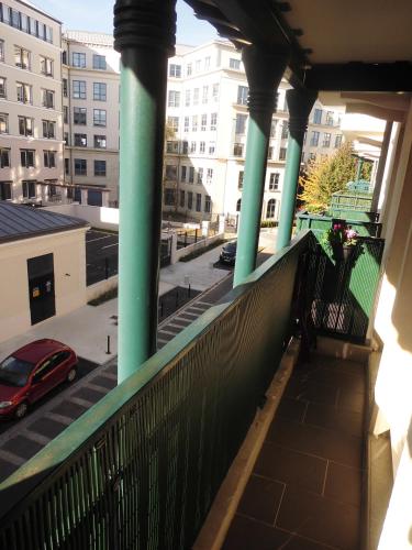 a balcony with a view of a parking lot at Briget Apartment in Chessy