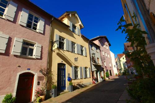 a street in a town with colorful buildings at Old Kings Design Hostel in Füssen