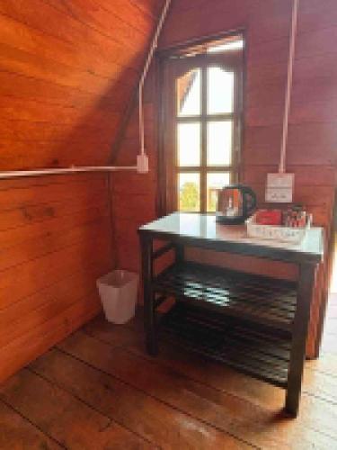 a room with a table in a room with a window at Mountain springs resort in Ban Nong Khieo