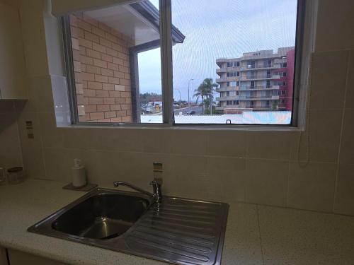 a sink in a kitchen with a window at Crystal Waters 7 Ocean Corridor Views, Restaurants, Town Centre in Forster