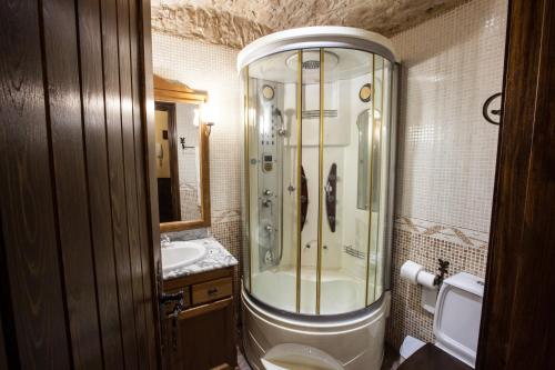 a bathroom with a shower and a sink at Alojamientos Rurales Benarum con Spa in Alpujarra De La Sierra